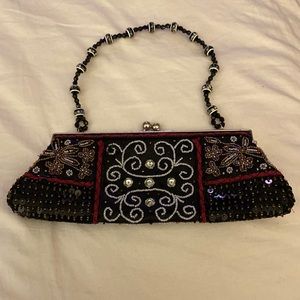 VINTAGE 1970’s beaded clutch Black with white and red beading. Very chic!